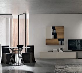 salotto moderno minimal con angolo tv e armadi di legno e tavolo e sedie in ferro