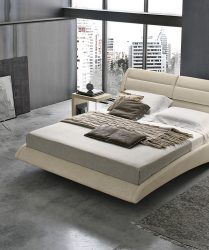 camera da letto moderna e minimal con letto di design con testiera imbottita, ambiente in stile industriale